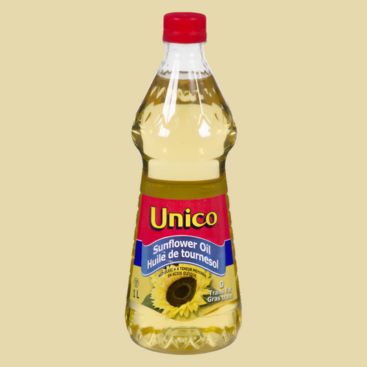 Bottle of Unico sunflower oil on a beige background