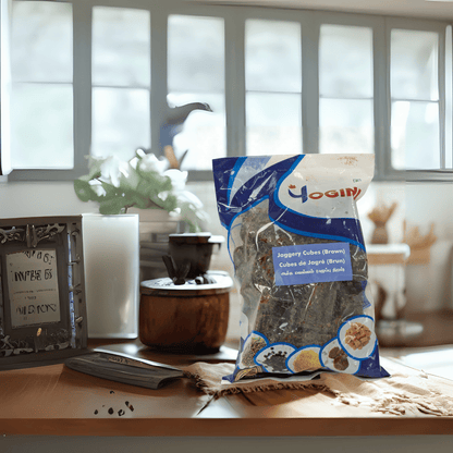 Bag of yogini jaggery cubes on a table with a blurred background