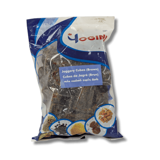 Packaged jaggery cubes with Yogini brand label on a transparent background